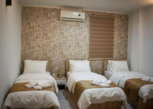 Postel nebo postele na pokoji v ubytování Hotel Alisa
