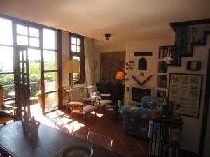 a living room with a couch and a chair at Casa Taormina in Taormina