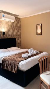 Postel nebo postele na pokoji v ubytování Hotel Alisa
