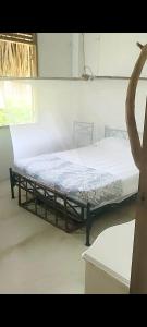 a bedroom with a bed in a room at la casablanca moñitos in Moñitos