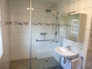 a bathroom with a shower and a sink at Fewo Anna in Bernkastel-Kues +11 photos