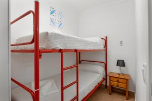 Кровать или кровати в номере Apartamento Magnolia Chiclana