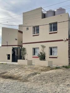 a large building with a door on the side of it at Depto funcional en Comodoro! in Comodoro Rivadavia