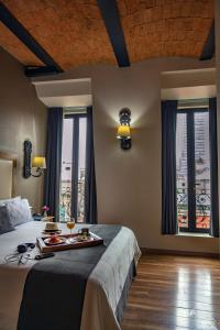 Letto o letti in una camera di Historico Central Hotel