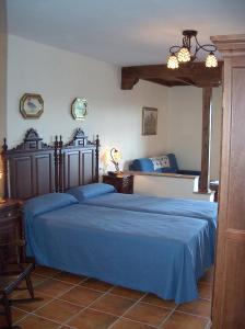Postel nebo postele na pokoji v ubytování Hotel Los Rebites