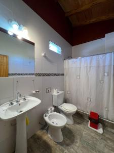 a bathroom with a sink and a toilet and a mirror at Hotel Francia in San Rafael +38 photos