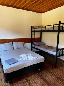 Postel nebo postele na pokoji v ubytování Chalés + 8 fotografií