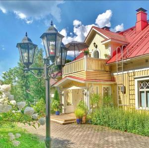 a house with a street light in front of it at Luukkaan Helmi in Lappeenranta