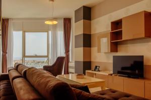 TV a/nebo společenská místnost v ubytování Hotel Tre Canne