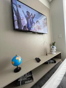 TV a/nebo společenská místnost v ubytování Essenciale Style 2104