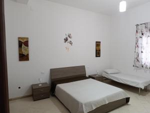 Ένα ή περισσότερα κρεβάτια σε δωμάτιο στο casa colombo