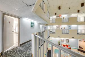 a view of a hallway in a hospital with stairs at Steps to Sand Myrtle Beach Gem with Oceanfront Pool in Myrtle Beach