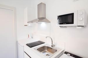 Kuchnia lub aneks kuchenny w obiekcie Letmalaga Soho Apartments