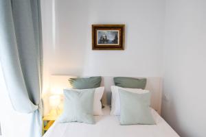 Łóżko lub łóżka w pokoju w obiekcie Letmalaga Soho Apartments