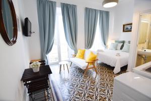 Łóżko lub łóżka w pokoju w obiekcie Letmalaga Soho Apartments