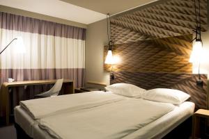 Ein Bett oder Betten in einem Zimmer der Unterkunft ibis Zurich Adliswil