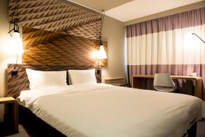 Ein Bett oder Betten in einem Zimmer der Unterkunft ibis Zurich Adliswil