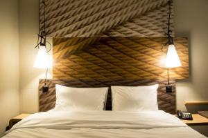 Ein Bett oder Betten in einem Zimmer der Unterkunft ibis Zurich Adliswil