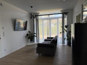 A television and/or entertainment centre at Renovated in style - Close to Hamburg
