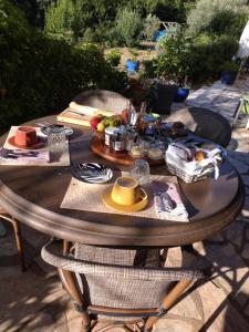 a wooden table with food on top of it at Occit'Homières in Saint-Pons