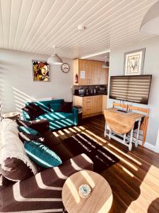 a living room with a couch and a table at 50 Toledo, Selsey Country club in Selsey