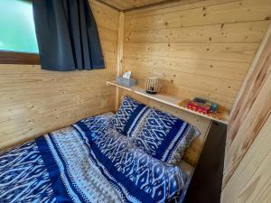 Postel nebo postele na pokoji v ubytování Elsass Tiny House