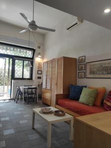 a living room with a couch and a table at La Tana in Formia