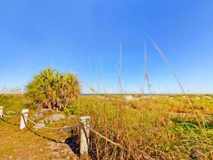 a fence in the middle of a field at Unit 109 -1br Apt Oceanfront Complex With Pool in Cocoa Beach