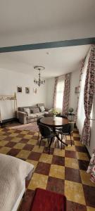 a living room with a table and a couch at Dokstudio50 in Ghent