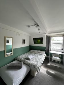 Ένα ή περισσότερα κρεβάτια σε δωμάτιο στο Keysan House 5