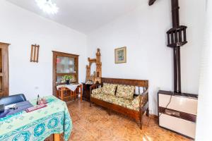 a living room with a couch and a table at beb san Nicola in Ortueri