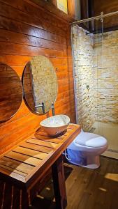 a bathroom with a sink and a toilet at El Mundo al Revés in Pacho