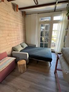 Postel nebo postele na pokoji v ubytování Het Koetshuis
