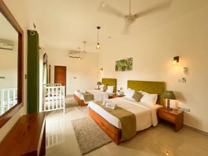 Ένα ή περισσότερα κρεβάτια σε δωμάτιο στο J leaf Hotel by Blue Bird +65 φωτογραφίες