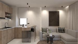 a kitchen and living room with a couch and a table at NAMA Suites in Limín Khersonísou