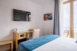 Postel nebo postele na pokoji v ubytování Relais San Francesco