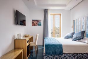 Postel nebo postele na pokoji v ubytování Relais San Francesco