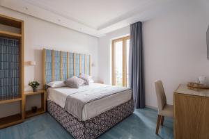Postel nebo postele na pokoji v ubytování Relais San Francesco