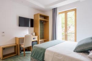 Postel nebo postele na pokoji v ubytování Relais San Francesco