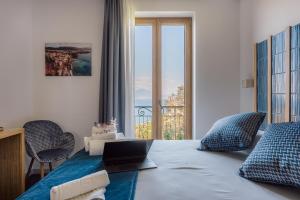 Postel nebo postele na pokoji v ubytování Relais San Francesco