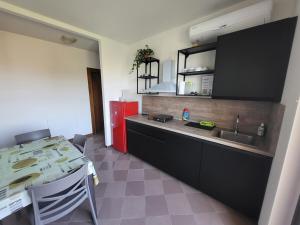 Kuchyň nebo kuchyňský kout v ubytování Villa Ghiaia locazione turistica + 22 fotografií