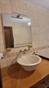 a bathroom with a large bowl sink and a mirror at La finca de Casa Botes in Cuenca +52 photos