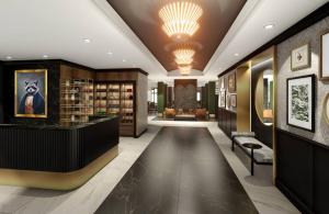 a lobby with a library with a reception desk at Hotel Vallea Bromont, Tapestry Collection by Hilton in Bromont +18 photos