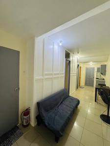 a room with a couch in the corner of a room at ACE Condo in Cebu City