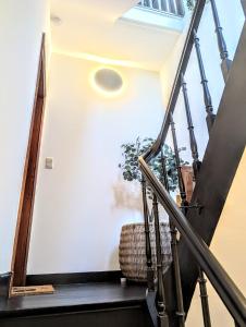 a staircase leading up to a house with a window at 't Herenhoes in Neerpelt