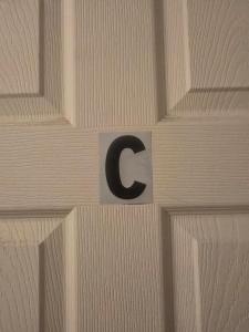 a sign on a wall with a letter on it at Grateful Hemphill B in Atlanta