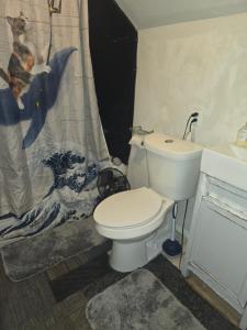 a bathroom with a toilet and a sink at Grateful Hemphill B in Atlanta