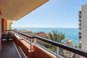 a balcony with a view of the ocean at Marbella Port Beachfront - EaW Homes in Marbella