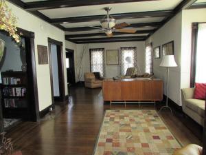 a living room with a couch and a ceiling fan at Walk to the Falls from The Mint in Niagara Falls