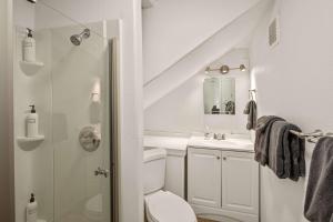 a bathroom with a shower and a toilet and a sink at Sedona Hilltop Retreat Deck with Red Rock Views in Sedona +9 photos